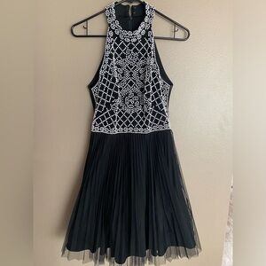 Black and white beaded cocktail high-neck dress.